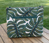 Back View Handcrafted Rifle Paper Co. Canvas Bayside Slim Crossbody Bag in Monstera Canvas with cotton canvas lining and adjustable Splenda vegetable-tanned leather strap.