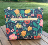 Back View Handcrafted Rifle Paper Co. Canvas Bayside Slim Crossbody Bag in Navy Botanical Floral Canvas with cotton canvas lining and adjustable Splenda vegetable-tanned leather strap.