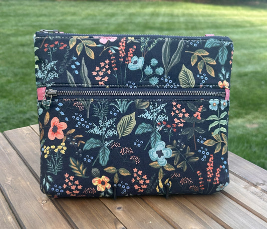 Front View Handcrafted Rifle Paper Co. Canvas Bayside Slim Crossbody Bag in Midnight Herb Garden Canvas with cotton canvas lining and adjustable Splenda vegetable-tanned leather strap.