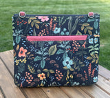 Back View Handcrafted Rifle Paper Co. Canvas Bayside Slim Crossbody Bag in Midnight Herb Garden Canvas with cotton canvas lining and adjustable Splenda vegetable-tanned leather strap.