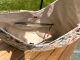 Close up interior view of the Compass Rose Shoulder bag in Rifle Paper Co. Herb Garden Natural Canvas. 