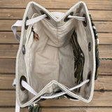 Monstera Canvas with Forest Green Duck Canvas and Antique Brass Hardware and Natural Webbing Strap and Natural Canvas interior Spa Creek Bucket Convertible Bag squirescanvascreations.com