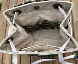 Monstera Canvas with Forest Green Duck Canvas and Antique Brass Hardware and Natural Webbing Strap and Natural Canvas interior Spa Creek Bucket Convertible Bag squirescanvascreations.com