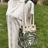 Monstera Canvas with Forest Green Duck Canvas and Antique Brass Hardware and Natural Webbing Strap and Natural Canvas interior Spa Creek Bucket Convertible Bag squirescanvascreations.com