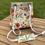 Camont Poppy Fields Canvas with Teal Green Duck Canvas and Antique Brass Hardware and Natural Webbing Strap and Natural Canvas Spa Creek Bucket Convertible Bag squirescanvascreations.com