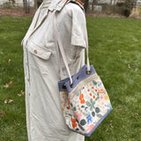 Strawberry Fields Canvas with Harbor Blue Stone Washed Canvas and Antique Brass Hardware and Natural Webbing Strap and Natural Canvas interior Spa Creek Bucket Convertible Bag squirescanvascreations.com