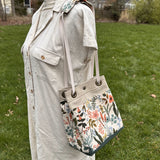 Amalfi-Herb Garden Canvas with Forest Green Duck Canvas and Antique Brass Hardware and Natural Webbing Strap and Natural Canvas interior Spa Creek Bucket Convertible Bag squirescanvascreations.com