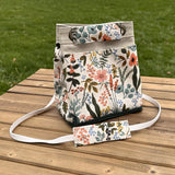 Amalfi-Herb Garden Canvas with Forest Green Duck Canvas and Antique Brass Hardware and Natural Webbing Strap and Natural Canvas interior Spa Creek Bucket Convertible Bag squirescanvascreations.com