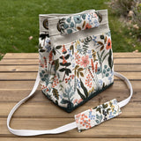 Amalfi-Herb Garden Canvas with Forest Green Duck Canvas and Antique Brass Hardware and Natural Webbing Strap and Natural Canvas interior Spa Creek Bucket Convertible Bag squirescanvascreations.com