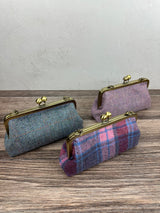 Collection of handcrafted Harris Tweed® kiss lock purses with bronze hardware. Classic clutch style with 2 card slots, fits a phone and small essentials. Wear as a clutch, shoulder bag, or crossbody. Made in Maryland, perfect for special occasions.