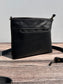 Front view of a handcrafted Leather Bayside Crossbody bag in Bomber Jacket Black Horween leather, showcasing its rich, warm color, natural grain, solid brass hardware, and full metal zipper. Designed and made in Maryland.