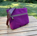 Front View Handcrafted Canvas Bayside Slim Crossbody Bag in Burgundy 18oz canvas with cotton canvas lining and adjustable Splenda vegetable-tanned leather strap. Lightweight and perfect for everyday wear.