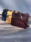 Collection of handcrafted Canvas Bayside Slim Crossbody Bags in waxed canvas, and solid canvas styles, with full canvas lining and adjustable vegetable-tanned leather straps.
