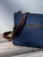 Up Close Front View Handcrafted Canvas Bayside Slim Crossbody Bag in Navy 18 oz canvas with cotton canvas lining and adjustable Splenda vegetable-tanned leather strap. Lightweight and perfect for everyday wear.