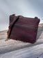 Front View Handcrafted Canvas Bayside Slim Crossbody Bag in Burgundy Waxed Twill with cotton canvas lining and adjustable Splenda vegetable-tanned leather strap. Lightweight and perfect for everyday wear.