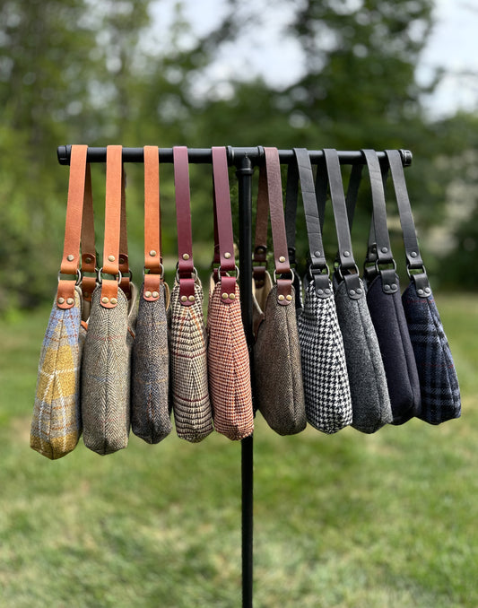 Harris Tweed® Rhode River Shoulder Bags group shot, 10 fabric-and-leather combos. Handcrafted in Maryland