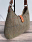 up close view Green Mix Herringbone Harris Tweed® Rhode River Shoulder Bags,  Cognac Leather with Antique Brass Hardware. Handcrafted in Maryland