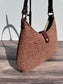 Close up view Fawn & Amber Harris Tweed® Rhode River Shoulder Bags,  Bordeaux Leather with Antique Brass Hardware. Handcrafted in Maryland