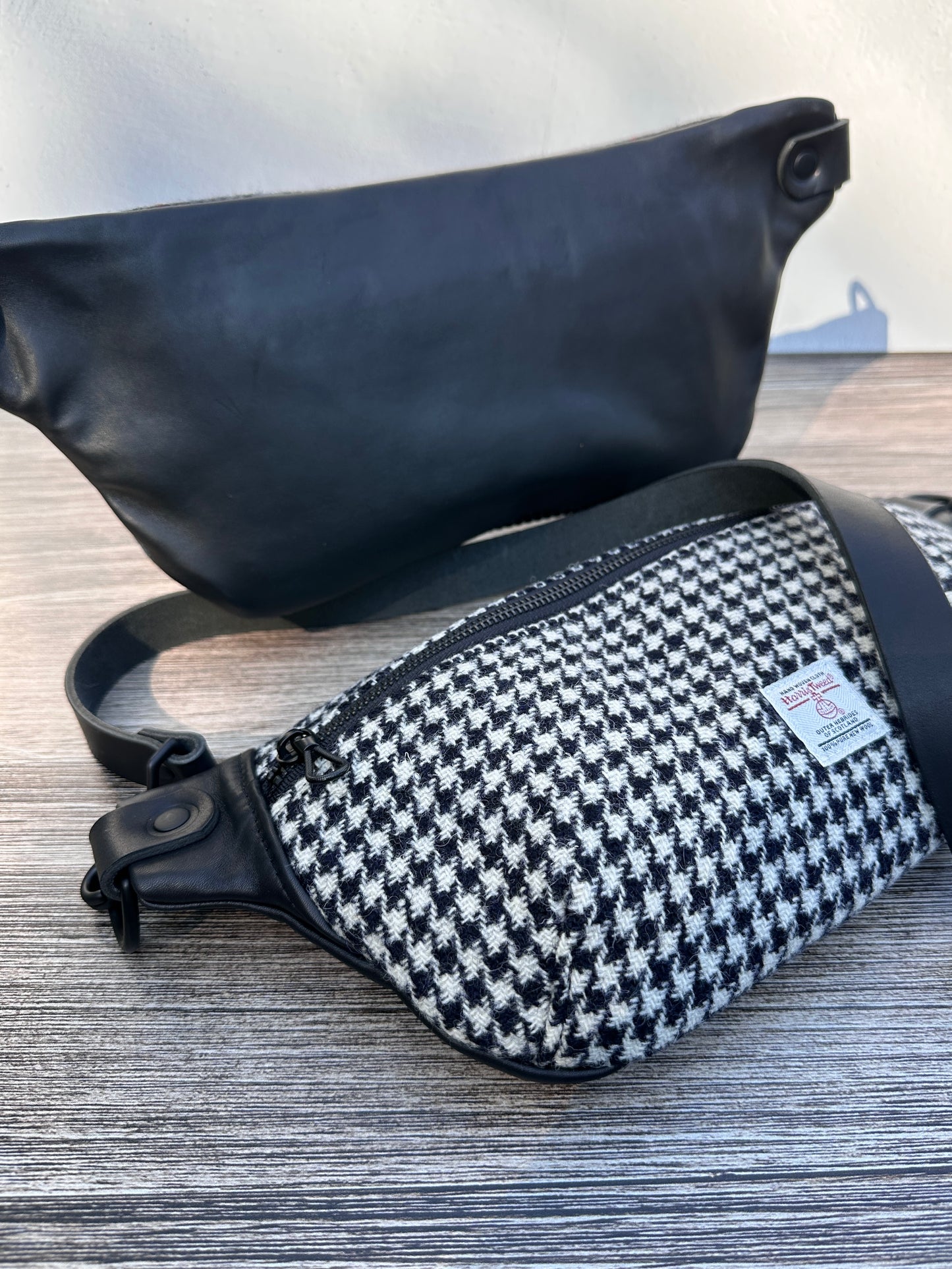 Luxury Black and White Houndstooth  Harris Tweed® and leather sling bag, handcrafted in Maryland with timeless design.