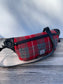 Minimalist sling bag handcrafted with Red and gray plaid Harris Tweed® and Horween Black Leather, finished with Matte Black hardware.
