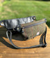 Minimalist sling bag handcrafted with Olive plaid Harris Tweed® and Horween Black Leather, finished with Antique Brass hardware.
