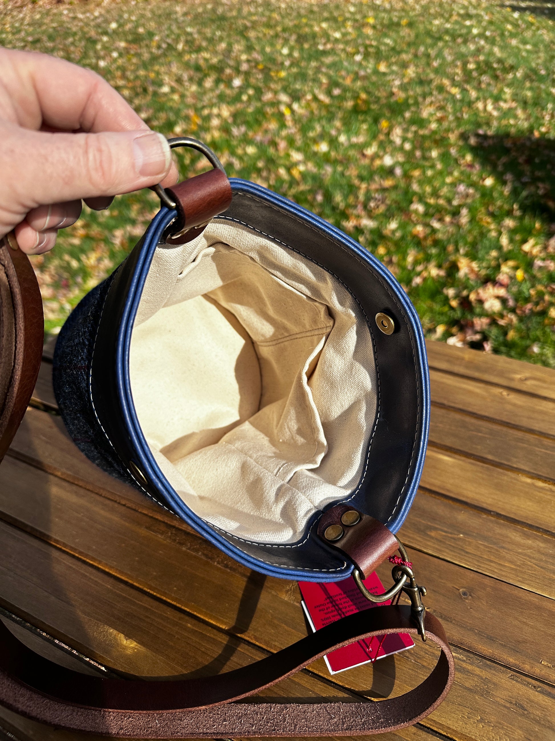 Inside view of the Harris Tweed® Lighthouse Crossbody round bag with flat bottom