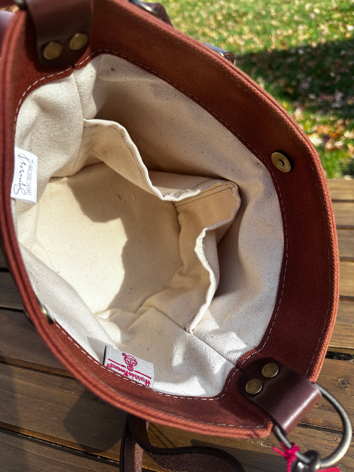 Inside view of the Harris Tweed® Lighthouse Crossbody round bag with flat bottom