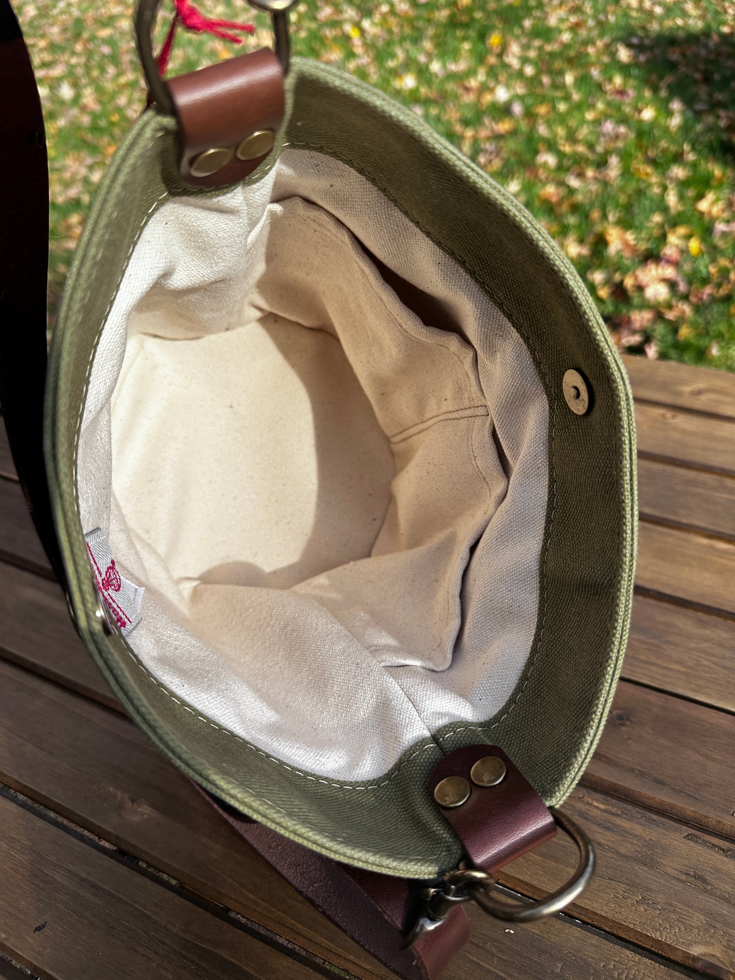 Inside view of the Harris Tweed® Lighthouse Crossbody round bag with flat bottom