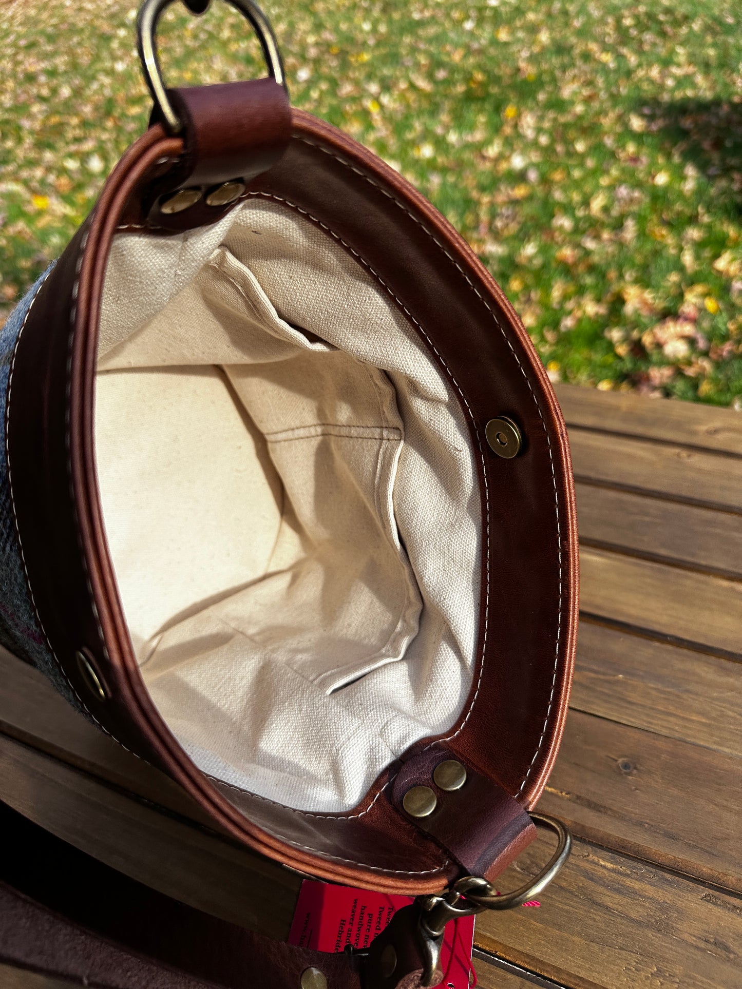 Inside view of the Harris Tweed® Lighthouse Crossbody round bag with flat bottom