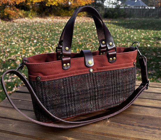 St. Andrews Harris Tweed® Tote standing upright, highlighting the Warm Brown Harris Tweed® and leather base. Handles Down. Made in MD