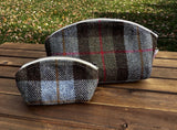 A large and small Seashell Pouch in Macleod Harris Tweed®.  The Seashell pouch has a curved top and flat base that stands up on its own and is lined with natural heavy canvas. 