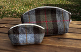 A large and small Seashell Pouch in Macleod Harris Tweed®.  The Seashell pouch has a curved top and flat base that stands up on its own and is lined with natural heavy canvas. 