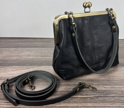 Handcrafted full-grain leather Princess Anne Kiss Lock handbag featuring a vintage-style frame and convertible straps.