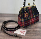 Harris Tweed® Princess Anne Kiss Lock Purse in Stewart Plaid with leather base, handbag strap, and crossbody strap — handcrafted in Maryland.