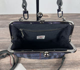 Open view of leather Princess Anne Kiss Lock Purse showing interior zipper pocket and leather card slot pocket — handcrafted in Maryland.