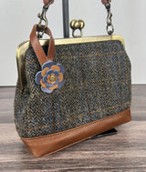 Leather flower bag charm on Harris Tweed Princess Anne Kiss Lock Bag – handcrafted leather accessory.