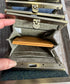 Open Mini Harris Tweed® Rock Hall Wallet showing the linen interior, two card slots, and the removable coin pocket in a slim accordion-style design.