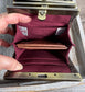 Open Mini Harris Tweed® Rock Hall Wallet showing the linen interior, two card slots, and the removable coin pocket in a slim accordion-style design.