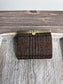 Closed Mini Harris Tweed® Rock Hall Wallet in Dark Brown Plaid, featuring Antique Brass flip-lock closure.