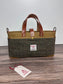 St. Andrews Harris Tweed® Tote standing upright, highlighting the Green-Brown Harris Tweed® and leather base. Made in MD