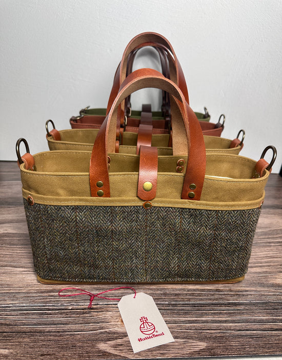 Group of St. Andrews Harris Tweed® Totes arranged together, showcasing the exterior, leather accents, and sturdy straps. Made in MD