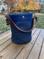 Dark Navy Harris Tweed® Lighthouse Crossbody round bag with flat bottom and Cobalt Blue Leather Accents