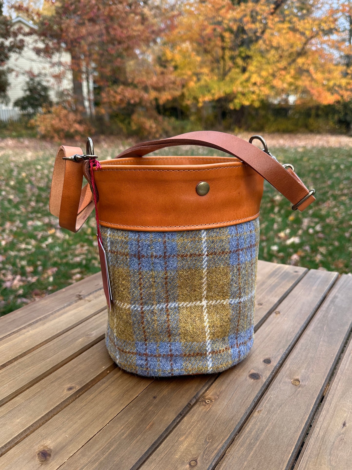 Yellow and Blue Harris Tweed® Lighthouse Crossbody round bag with flat bottom and Acorn Leather Accents