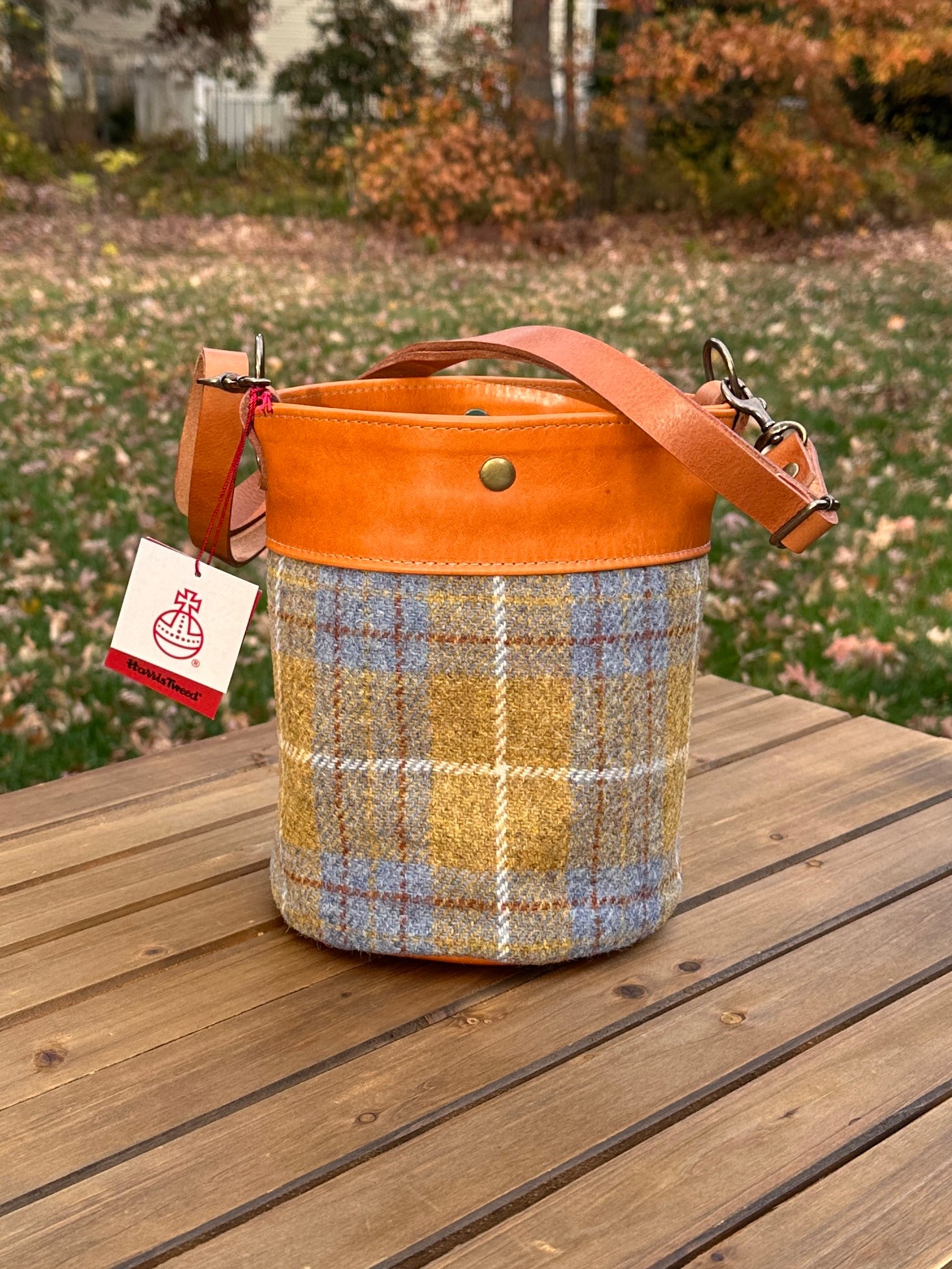 Yellow and Blue Harris Tweed® Lighthouse Crossbody round bag with flat bottom and Acorn Leather Accents