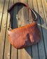 Sienna Leather Holland Island Crossbody bag with antique brass hardware and adjustable strap. 