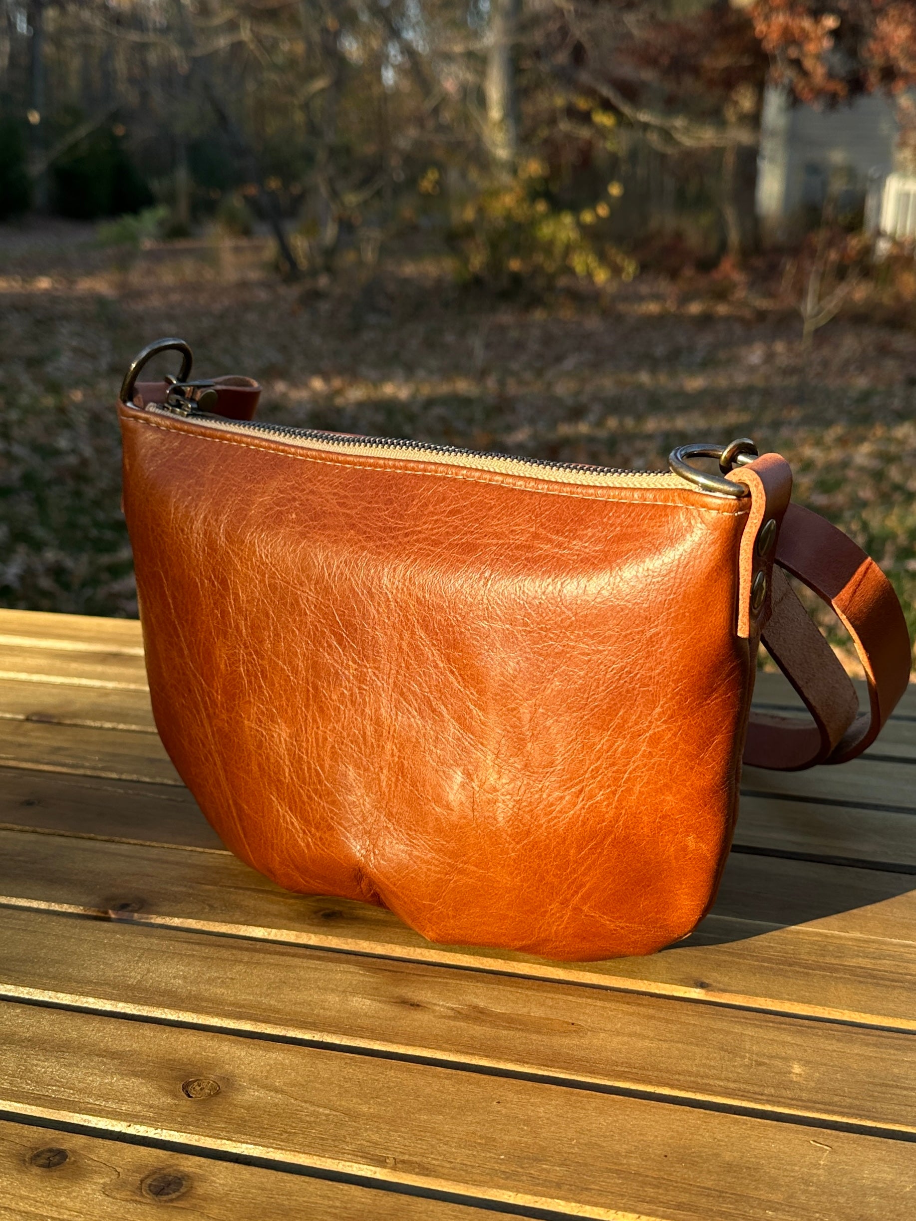 Sienna Leather Holland Island Crossbody bag with antique brass hardware and adjustable strap. 