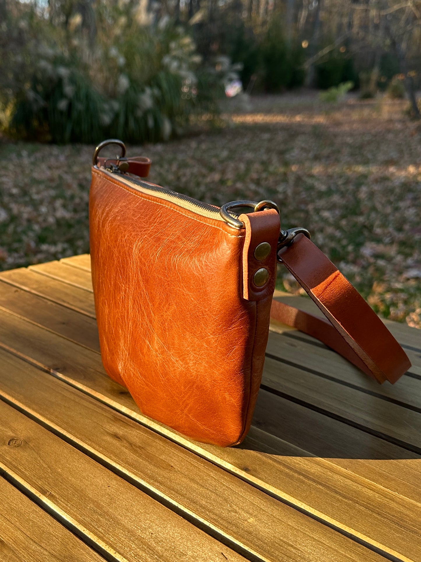 Sienna Leather Holland Island Crossbody bag with antique brass hardware and adjustable strap. 