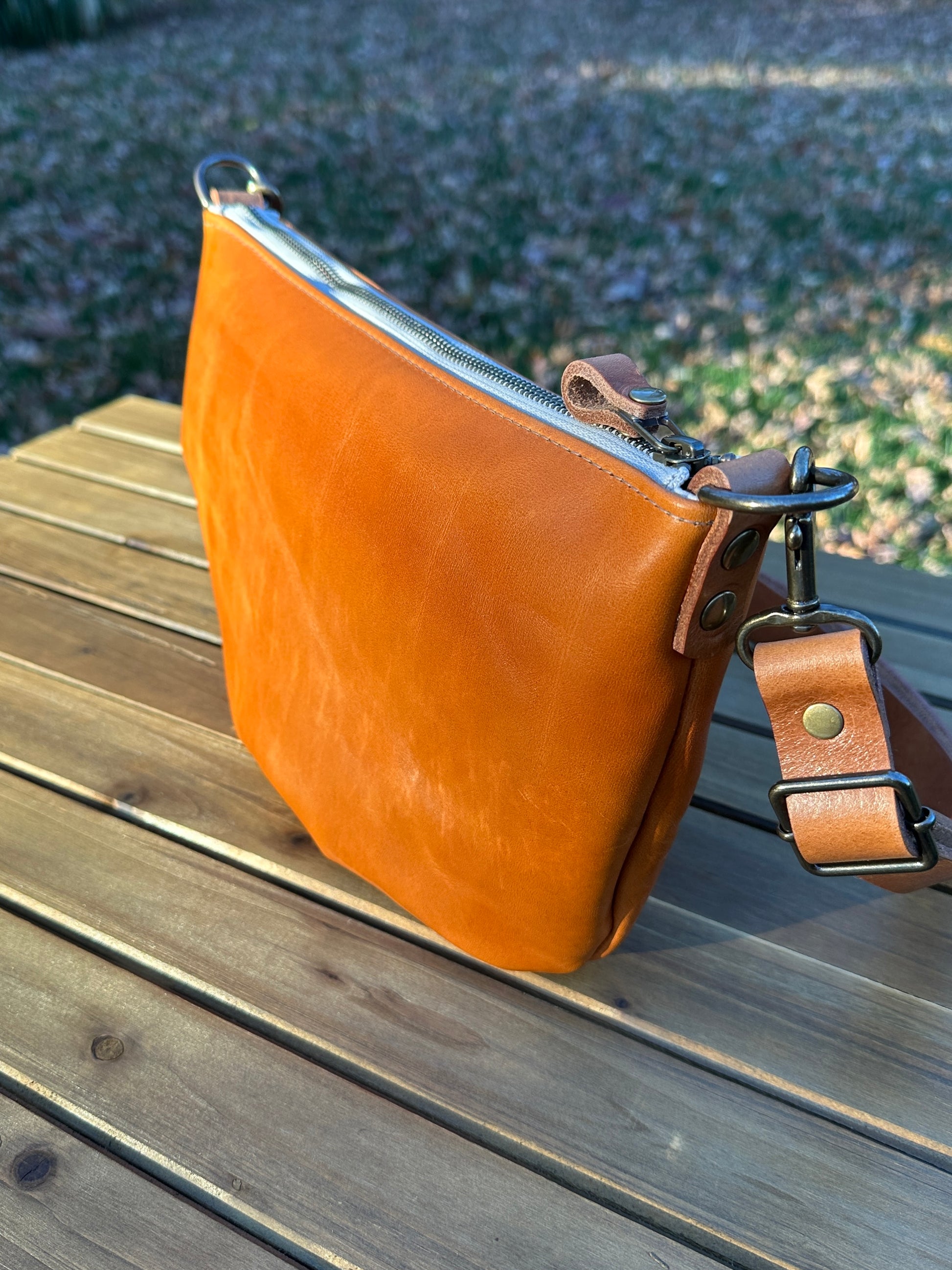 Acorn Leather Holland Island Crossbody bag with antique brass hardware and adjustable strap. 