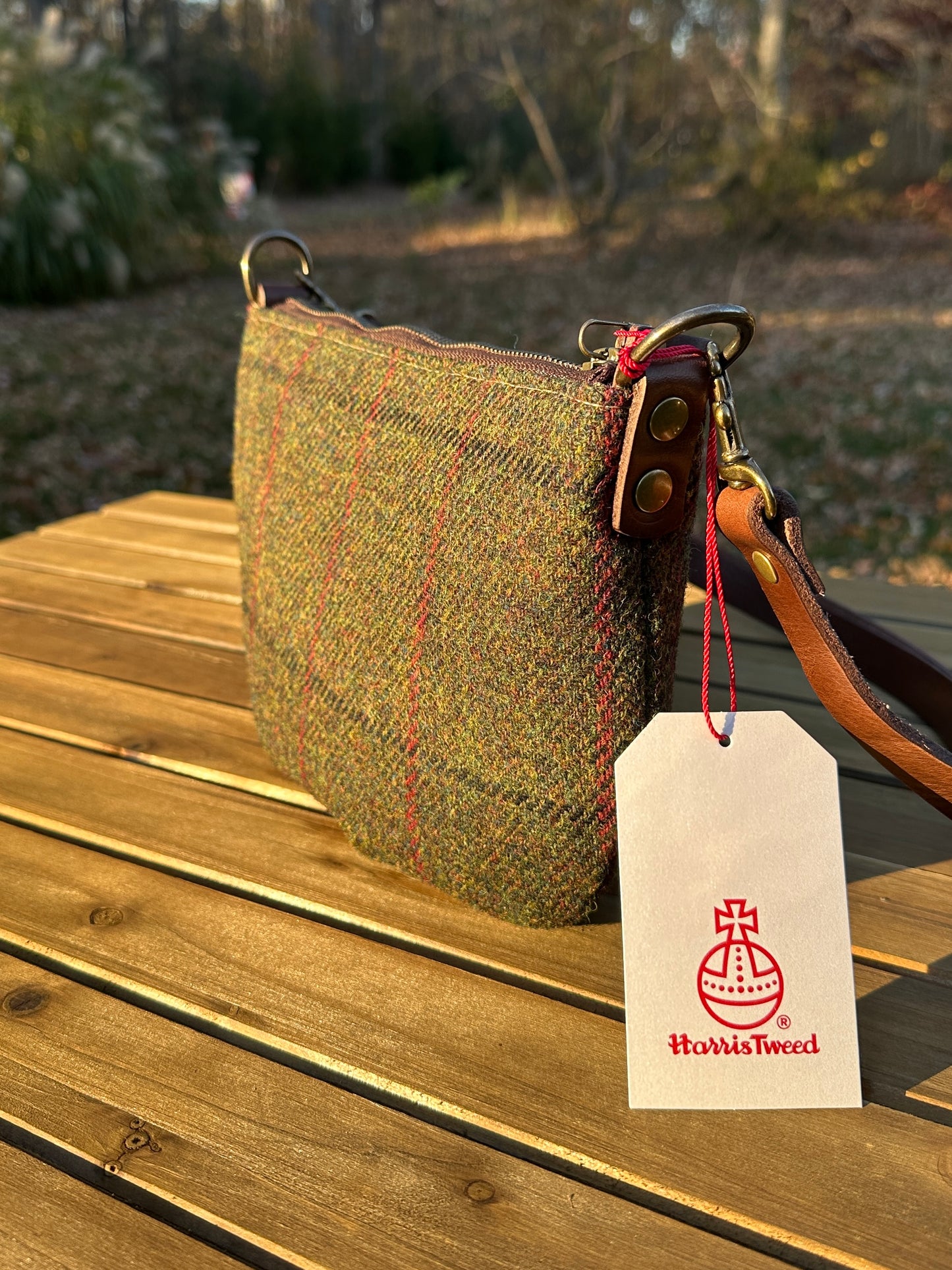 Green Twill with overcheck Harris Tweed® with adjustable strap and antique brass hardware.