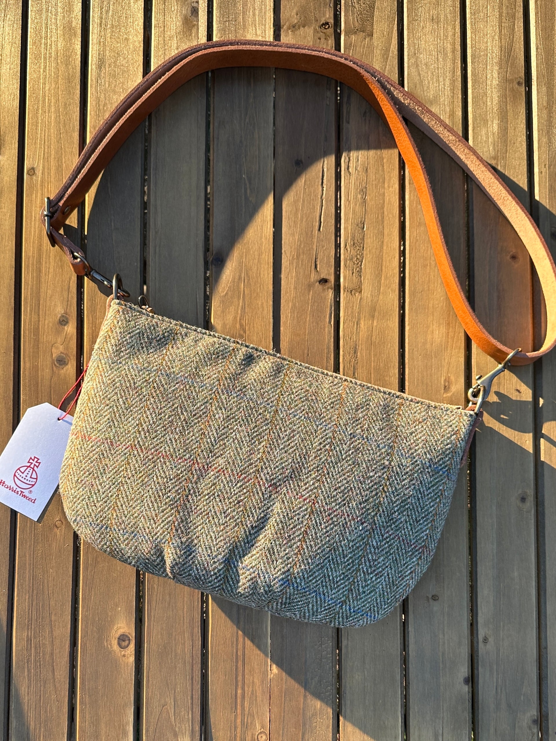 Green Herringbone Harris Tweed® Holland Island Crossbody bags with adjustable and antique brass hardware.